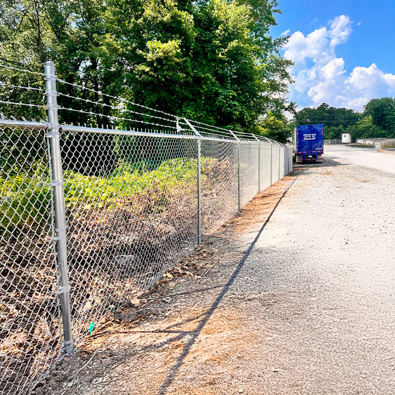 Chain link fence installation in Duluth GA backyard