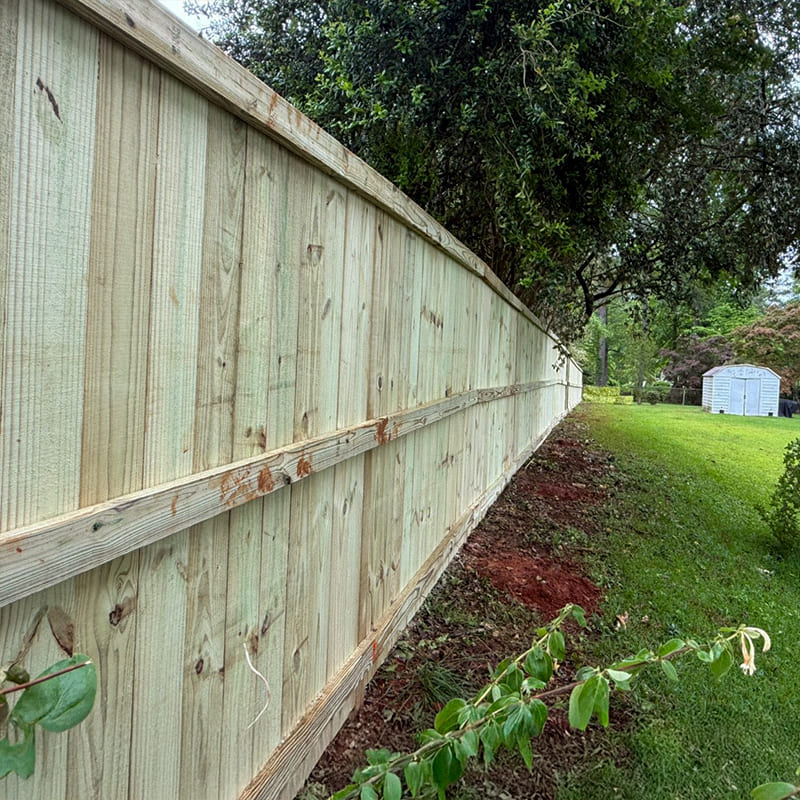 Custom cedar wood fence built by Hawk Fences LLC in Brookhaven