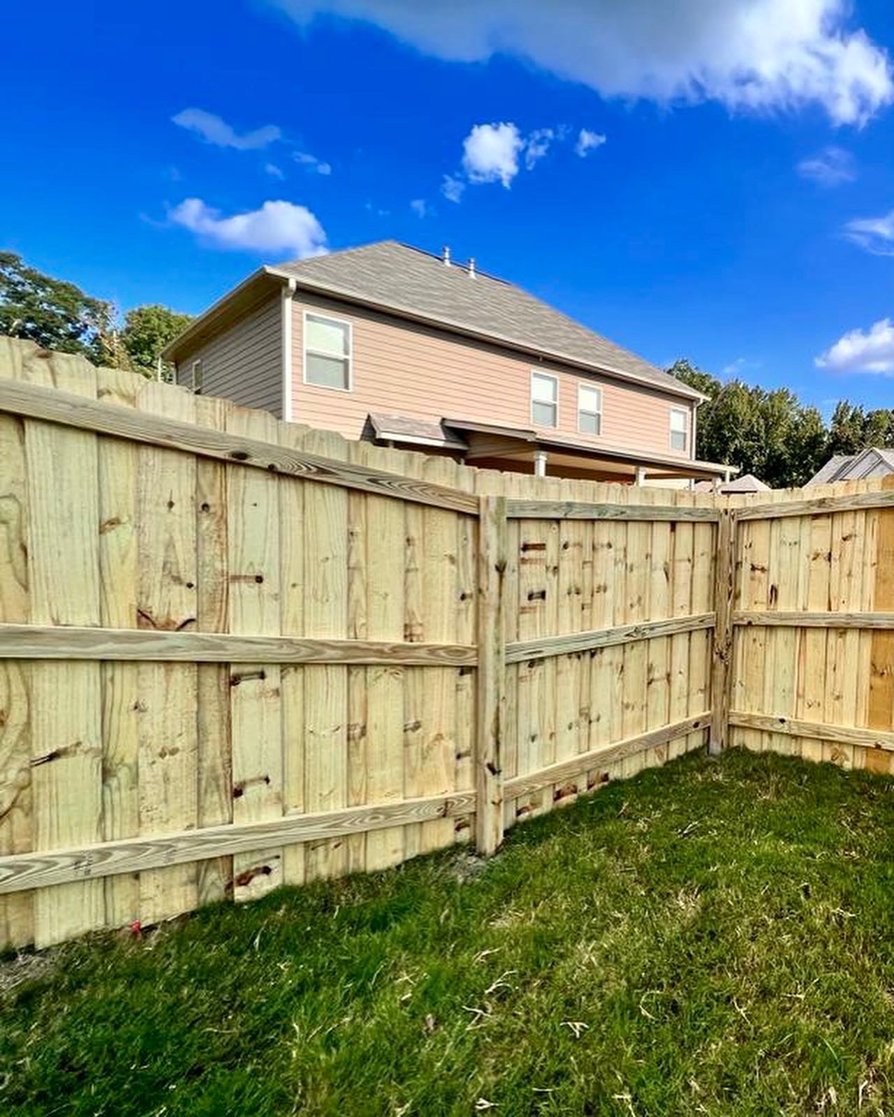 Finished privacy fence installation with secure and attractive design
