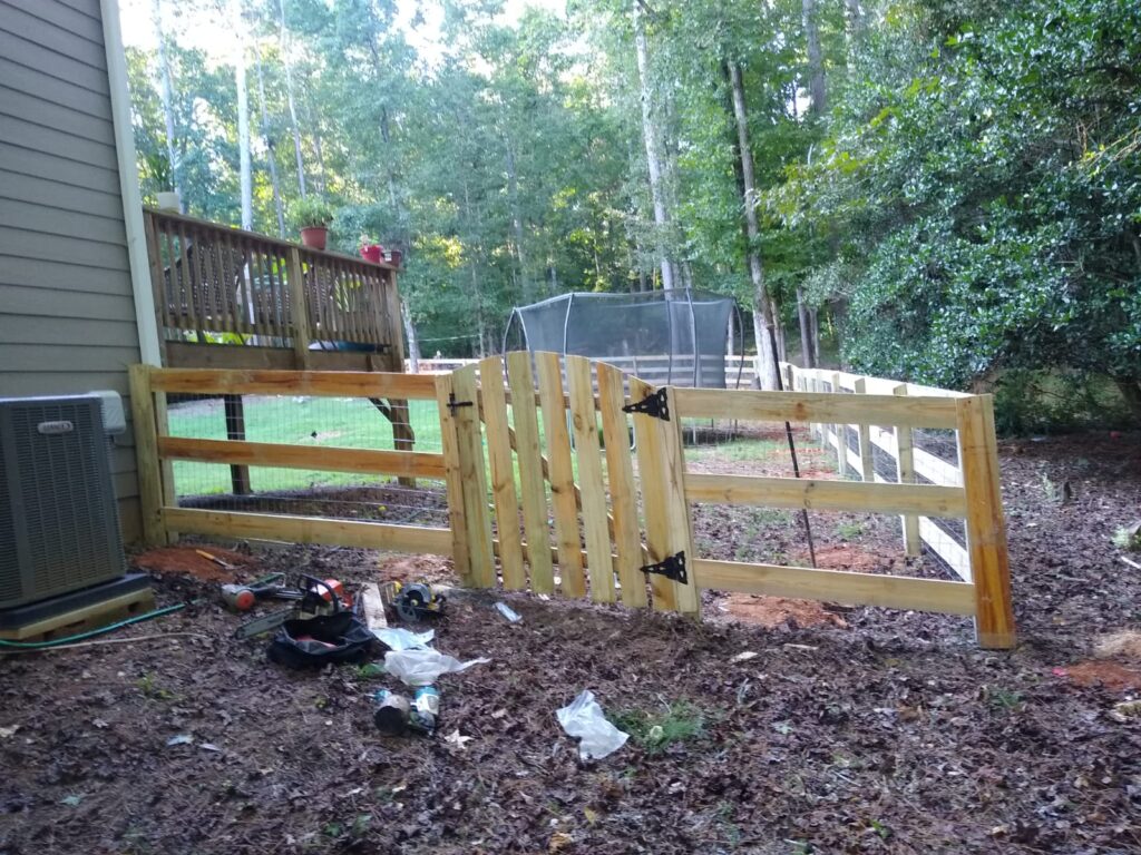 Durable vinyl picket fence enclosing front yard with landscaping