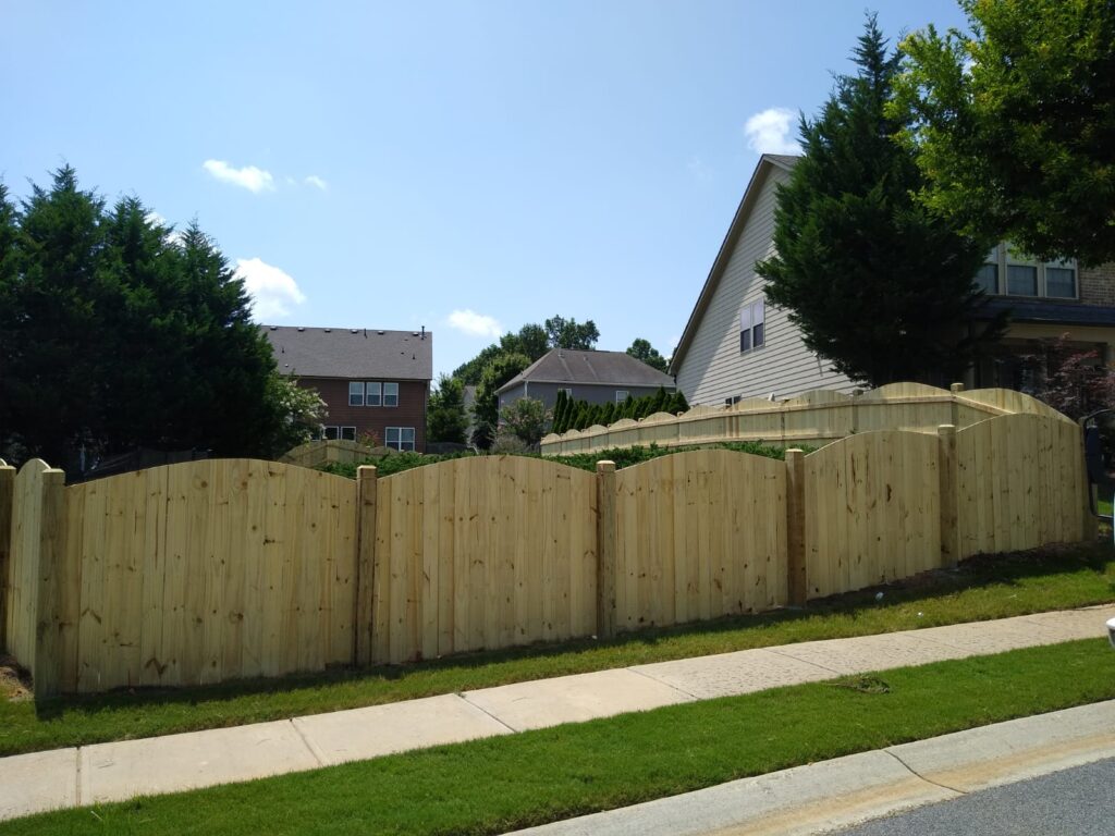 Custom wood privacy fence installation in Lawrenceville GA backyard