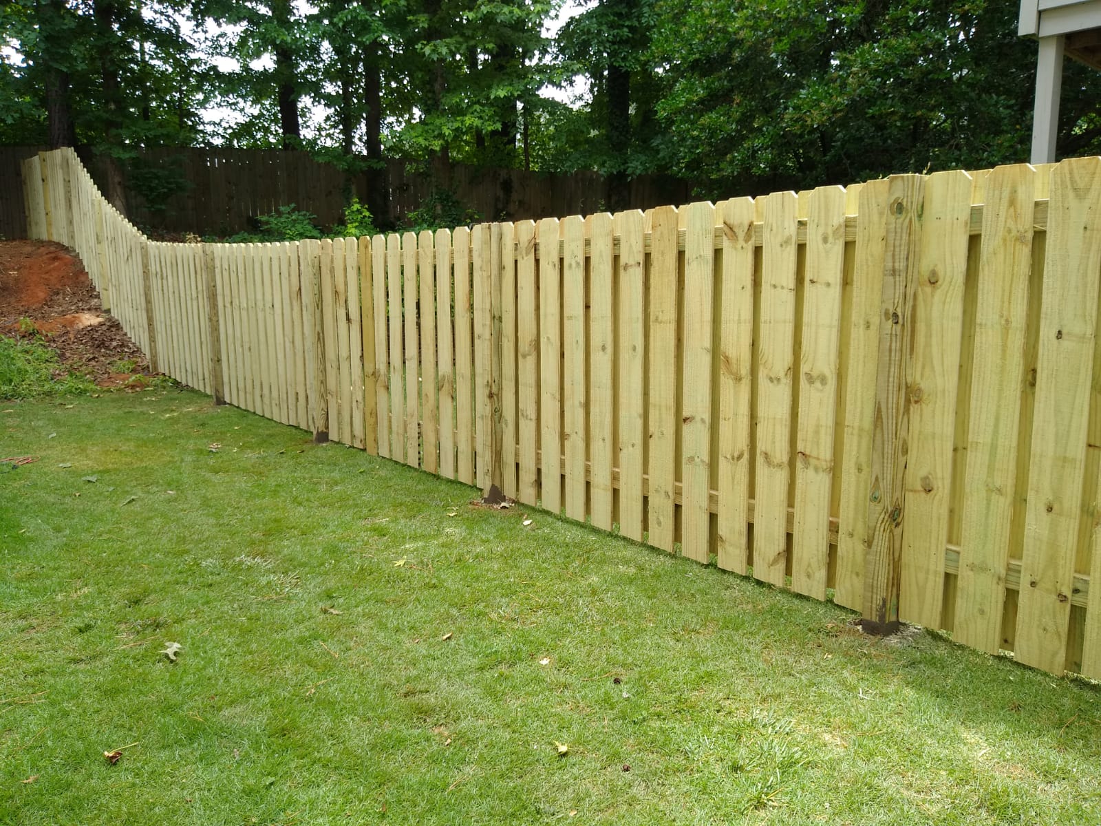 Wood privacy fence installation in Marietta GA backyard