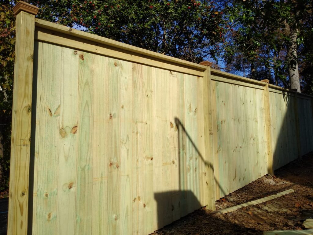 Custom wood picket fence built by Hawk Fences LLC in Kennesaw