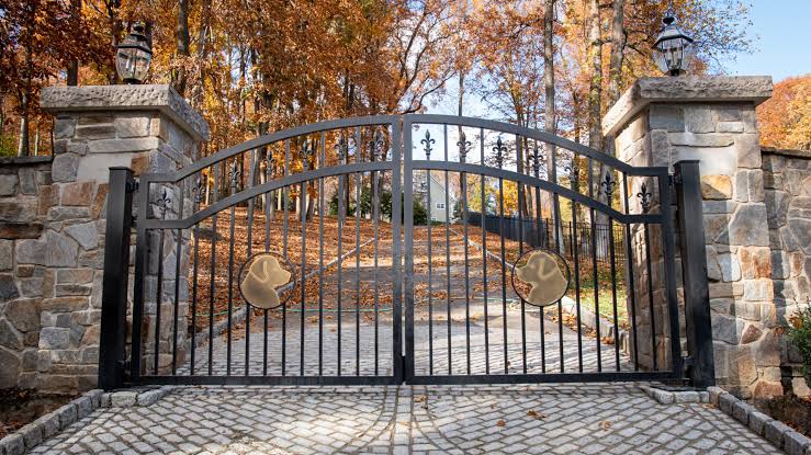 Custom residential driveway gate by Hawk Fences LLC in Alpharetta, GA