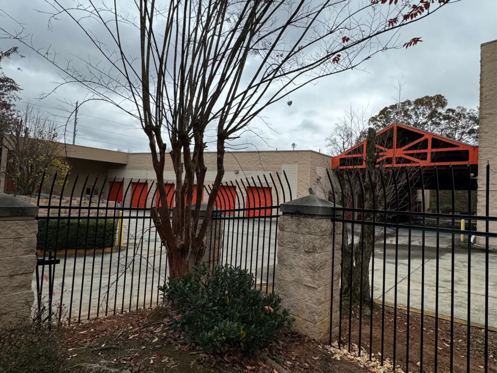 Driveway Gates in McDonough - GA being fitted with an automatic opener at a residential entrance