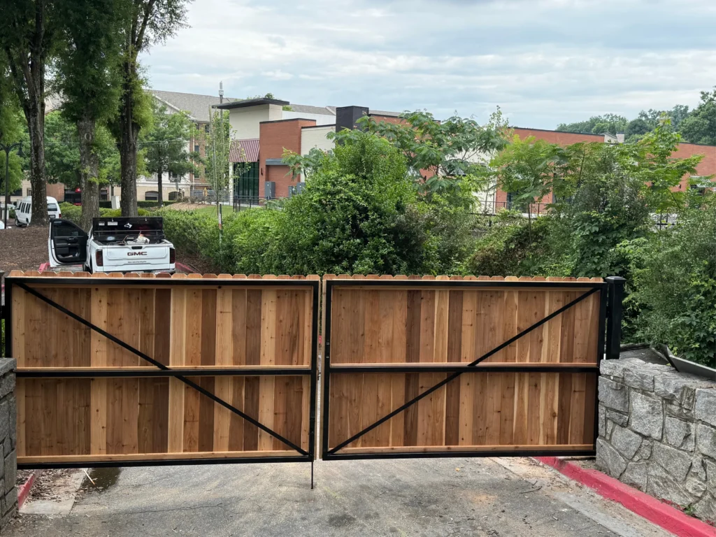 Driveway Gates in McDonough - GA being fitted with an automatic opener at a residential entrance