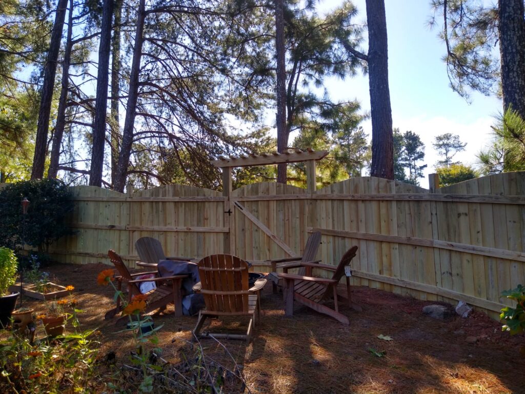 Contractor performing Fence Repair on a storm-damaged wooden boundary in Atlanta Metro Area - GA