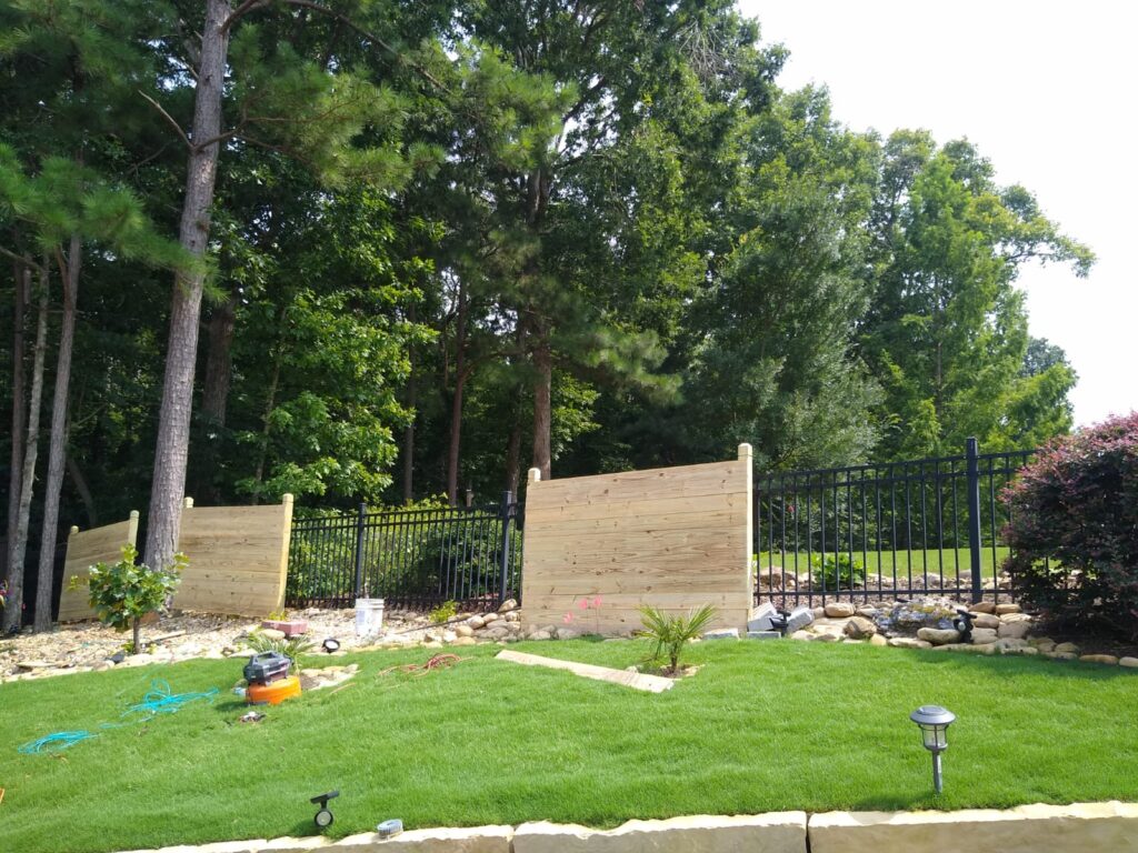 Driveway Gates in McDonough - GA being fitted with an automatic opener at a residential entrance